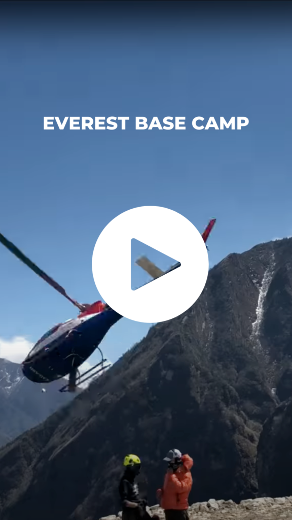 Helicopter taking off from the side of a mountain.