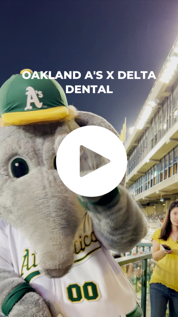 Oakland A's mascot giving peace sign.